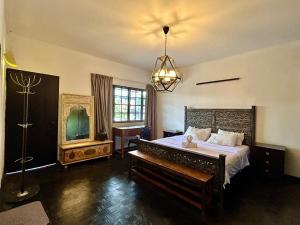 a bedroom with a large bed and a large window at Cozy family Homestay Suite in Shared Bungalow SS2 PJ in Petaling Jaya