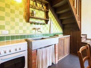 a kitchen with a sink and a stove at Scenic Stay near Florence in Poggio Alla Croce