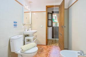 a bathroom with a toilet and a sink at Loft B2, Apartment in Seville in Seville +27 photos