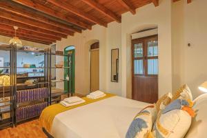 a bedroom with a bed and a wooden ceiling at Loft B2, Apartment in Seville in Seville