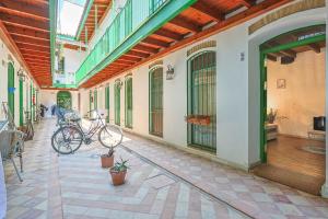 two bikes parked on the side of a building at Loft B2, Apartment in Seville in Seville