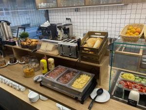 a kitchen with a bunch of food on a counter at Hotel Orion in Budapest