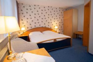 Postel nebo postele na pokoji v ubytování Gruppenhaus Sankt Andreasberg Braunlage