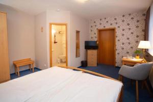 Postel nebo postele na pokoji v ubytování Gruppenhaus Sankt Andreasberg Braunlage + 12 fotografií