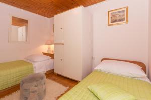 A bed or beds in a room at Duplex Studio Traversa- Split Old Town