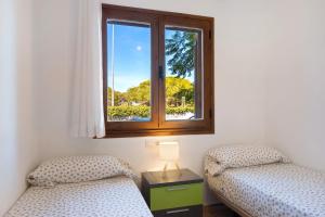 Postel nebo postele na pokoji v ubytování Marismas Sancti Petri + 21 fotografií