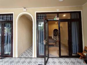 a room with an open door with a mirror at Nắng Vĩnh Hy in Ninh Hải