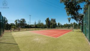 a tennis court with a bench on it at Flatbook Seaside Baltica Tower - Apartment with Sea View, Gym & Parking in Gdańsk