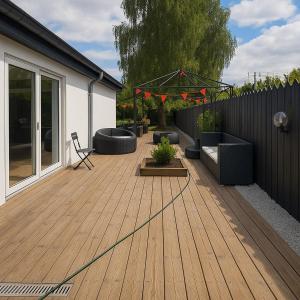 a wooden deck with furniture and a fence at Luxury villa with modern design & spa bathroom in Tåstrup