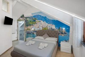 a bedroom with aamicamicamic view of a city at Le 5 Perle in Agerola