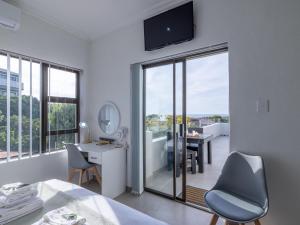 Μια τηλεόραση ή/και κέντρο ψυχαγωγίας στο Bella Madre Guesthouse