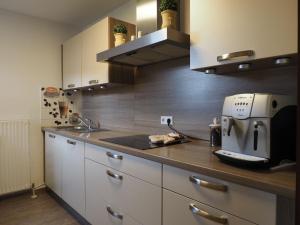 a kitchen with a coffee maker on a counter at Ferienwohnung Obersulm in Obersulm
