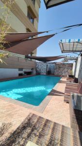 a swimming pool in the middle of a building at Atmosphere Hotel & Spa in Antananarivo