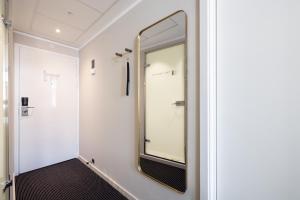a dressing room with a mirror on the wall at The Square in Copenhagen +83 photos