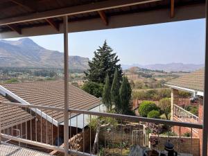 a view of a house with mountains in the background at Sanchen's in Clarens