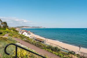 a view of a beach and the ocean at Stunning Jurassic 3 bed with views over Lyme Bay in Lyme Regis