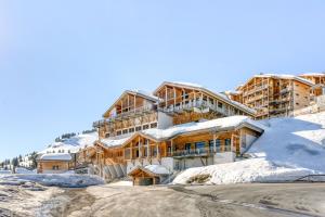 a building on top of a snow covered mountain at Dormio Resort Les Portes du Grand Massif in Flaine
