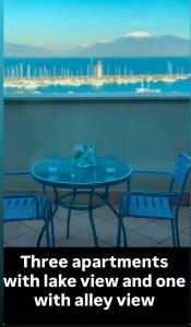 a table with two chairs and a view of the ocean at Molino Apartments in Desenzano del Garda
