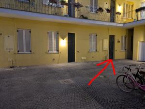 a pair of bikes parked in front of a building at Malpensa sweet home in Busto Arsizio