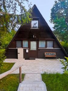 a house with a bench in front of it at Ferienhaus Bayern in Siegsdorf