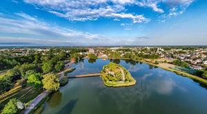 an island in the middle of a body of water at LUX Apartament in Suwałki