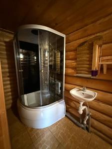 a bathroom with a shower and a sink at Під Горбком in Bukovets +86 photos