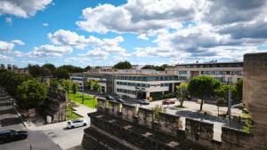 an aerial view of a city with buildings at STRAVINSKY Apartments Avignon - Get our Last best deals ! in Avignon