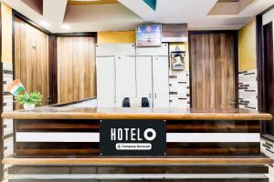 a hotel reception desk in a hotel lobby at Super Hotel O Fazalpur in Delhi