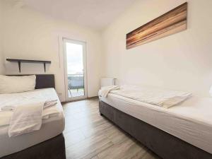 Postel nebo postele na pokoji v ubytování STB114 moderne Monteurwohnung