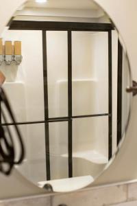 a mirror with a reflection of a door in it at Tiny Home - Grill, Near East Fork in Mentone +34 photos