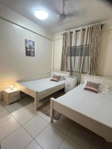 En eller flere senge i et værelse på Buxton Point Swahili Cozy Place + 90 billeder