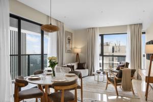 a living room with a table and chairs at GTC Elephant 2 bed by YourHost Nairobi in Nairobi