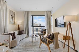a living room with a couch and a table at GTC Elephant 2 bed by YourHost Nairobi in Nairobi