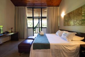 Кровать или кровати в номере Águas de Santa Bárbara Resort Hotel