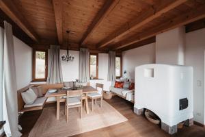 a living room with a table and a couch at Ferienhaus Am Grassnitzberg 18 in Straß in Steiermark