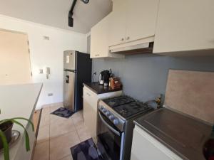 Kuchyň nebo kuchyňský kout v ubytování Hermoso Departamento en Villarica + 3 fotografie