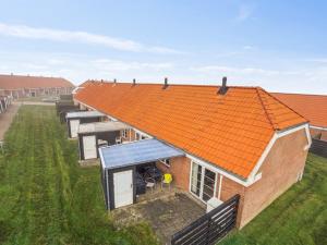an overhead view of a house with an orange roof at Holiday Home Ubbe - 200m from the sea by Interhome in Lemvig