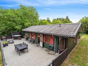 an overhead view of a house with a patio at Holiday Home Nyalle - 30km from the sea by Interhome in Toftlund +15 photos