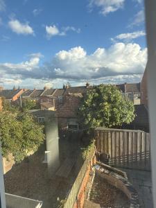 a view from a window of a city with houses at The Clare Court 6BR Luxury Retreat - Sleeps 14 with Complimentary Access to Billing Aquadrome Holiday Village for Swimming - 2 nights minimum in Kingsthorpe
