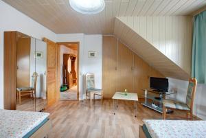 Un televizor și/sau centru de divertisment la Ferienwohnung Hildegard