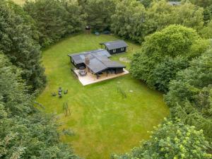 an overhead view of a house in the middle of a yard at Holiday Home Gudrid - 250m to the fjord by Interhome in Højslev
