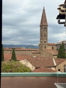 a view from the roof of a building with a tower at Bohèmian View Santa Maria Novella in Florence
