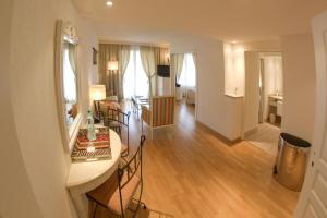 a kitchen and living room with a table and chairs at STRAVINSKY Apartments Avignon - Get our Last best deals ! in Avignon