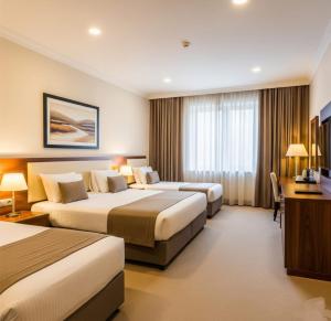 Postel nebo postele na pokoji v ubytování Xetai Royal Hotel & Restaurant