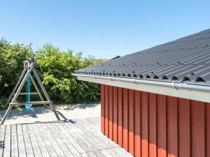 a metal roof on the side of a building at Holiday Home Kirsten - 800m from the sea by Interhome in Henne Strand +23 photos