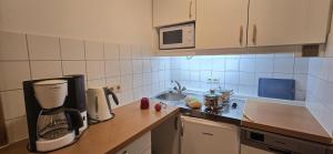 a kitchen with a coffee maker on a counter at Ferienwohnung Auer Kitzbüheler Alpen ITD099 in Itter