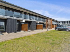a building with a car parked in front of it at Apartment Kimi - 100m from the sea by Interhome in Havneby