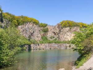 a view of a river with trees and rocks at Holiday Home Marlies - 300m from the sea by Interhome in Allinge