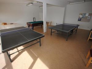 two ping pong tables in a room with a ping pong ball at Apartment Milly - 150m to the inlet by Interhome in Vestervig