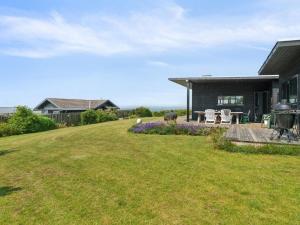 a house with a large yard in front of it at Holiday Home Niesina - 100m from the sea by Interhome in Kalundborg